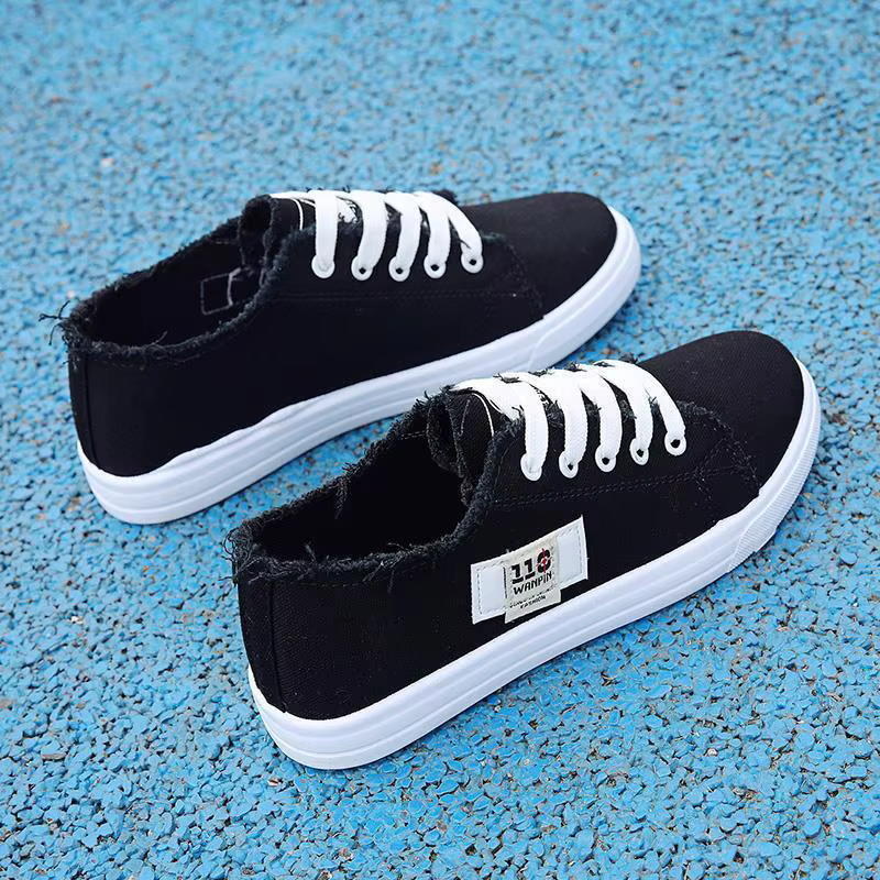 Nouvelles chaussures plates décontractées confortables en toile blanches à lacets croisés légères po