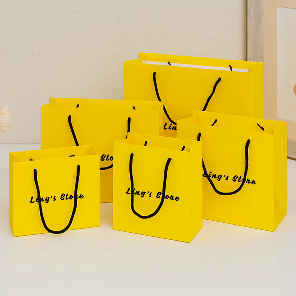 Sac cadeau jaune accrocheur pour bijoux avec poignées, pochette de shopping en papier avec ruban pou