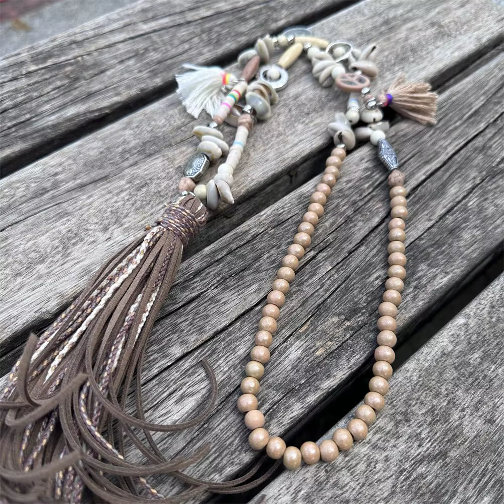 Femmes mode cuir gland longue perle pendentif collier pull chaîne accessoires bijoux à la mode