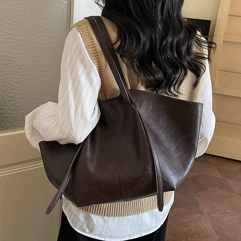 Sac fourre-tout rétro grande capacité, nouveau style 2026, sac de banlieue à bandoulière unique, sac de shopping populaire transfrontalier