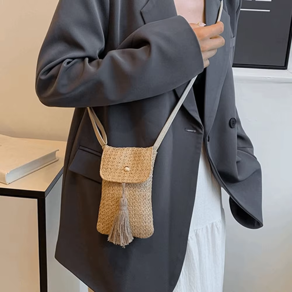 Sac à main portable en paille tressée avec longue pampille, pochette pour téléphone faite à la main pour femme, design de niche, style coréen, sac de plage tressé pour l'extérieur