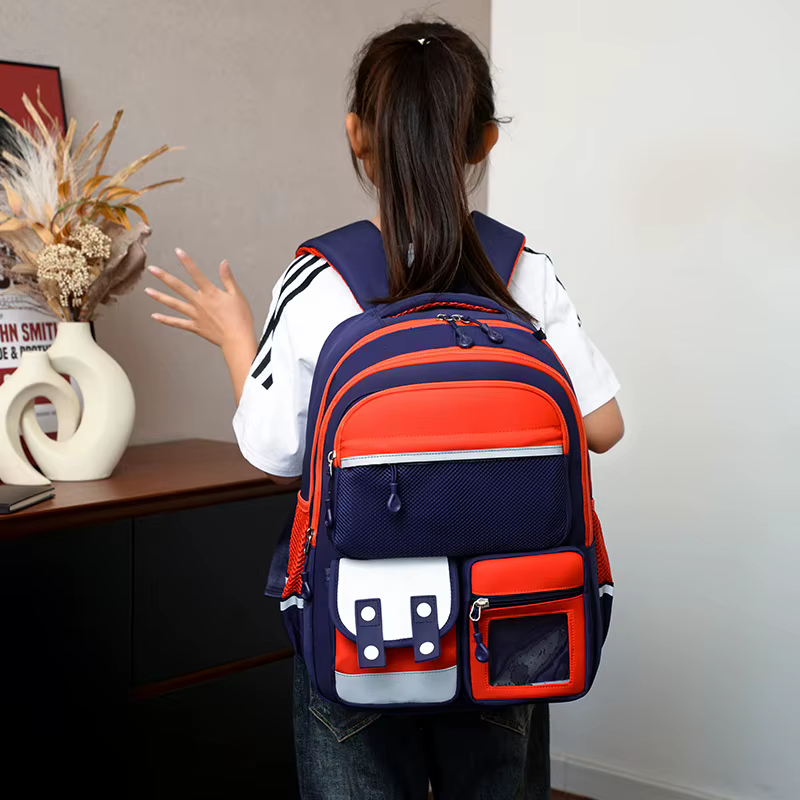 Nouveau Sac à Dos Scolaire Maternelle Dessin Animé Grande Capacité Double Bretelles Protection de la Colonne Vertébrale Réduction de la Charge Nylon Imperméable Unisexe