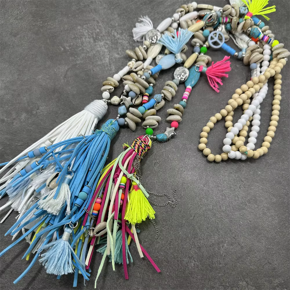 Femmes mode cuir gland longue perle pendentif collier pull chaîne accessoires bijoux à la mode