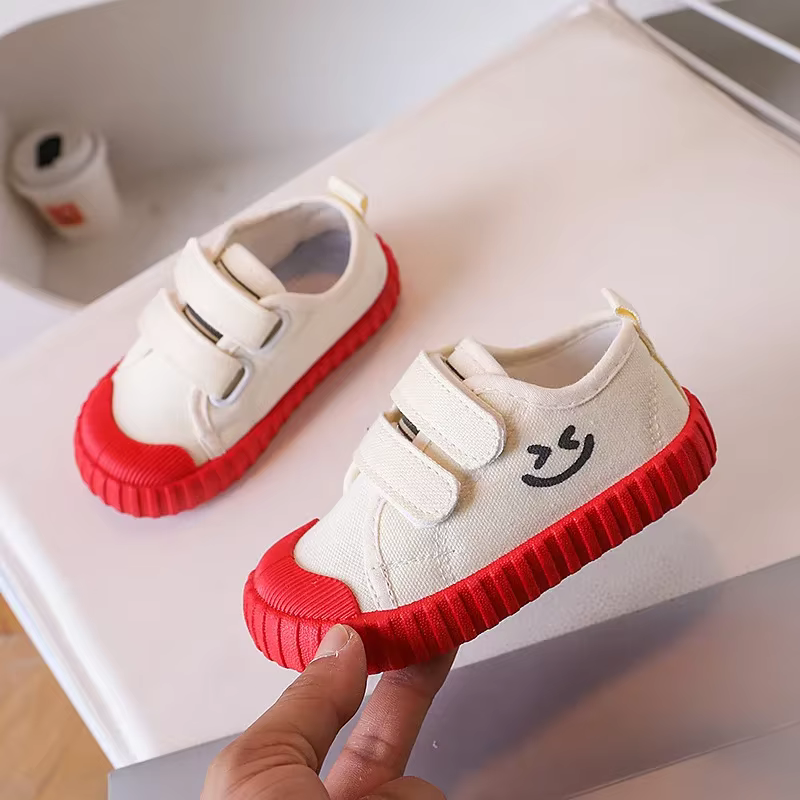 Chaussures en toile pour enfants Version coréenne visage souriant chaussures décontractées printemps garçons filles chaussures académie maternelle confortable quotidien
